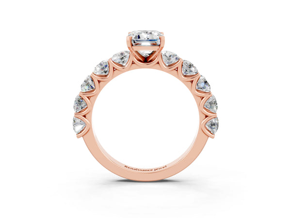 Rose gold Emerald Cut Moissanite Prong Setting with Side Stones on a Pave Band