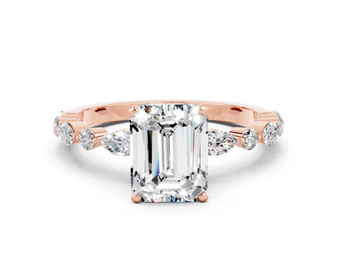 Rose gold Emerald Cut Moissanite Solitaire with Side Stones on a Pavé Band and Four-Prong Setting