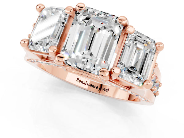 Rose gold Emerald Cut Moissanite Three-Stone Ring with Channel Set Band and Four-Prong Setting