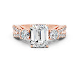 Rose gold Emerald Cut Moissanite Three-Stone Ring with Pavé Split Shank and Four-Prong Setting