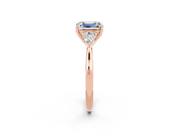 Rose gold Emerald Cut Moissanite Three-Stone Ring with Pear  Side Stones and Prong Setting