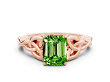Rose gold Emerald Cut Peridot Solitaire Engagement Ring with Celtic Knot Band and Four-Prong Setting