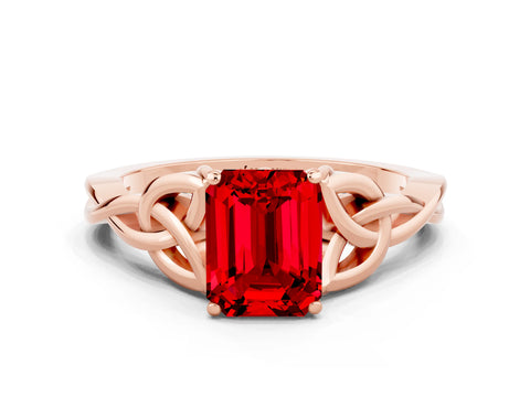 Rose gold Emerald Cut Ruby Solitaire Engagement Ring with Celtic Knot Band and Four-Prong Setting