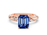 Rose gold Emerald Cut Solitaire Diamond Engagement Ring with Twisted Pave Band and Four-Prong Setting