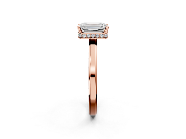 Rose gold Emerald Cut Solitaire Engagement Ring with Four-Prong Setting on a Classic Band