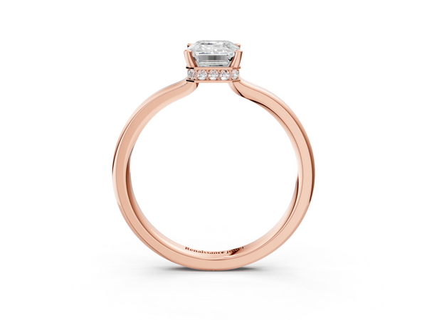 Rose gold Emerald Cut Solitaire Engagement Ring with Four-Prong Setting on a Classic Band