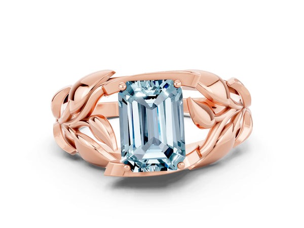Rose gold Emerald Cut Aquamarine Leaf-Inspired Engagement Ring with Round Accents and Prong Setting