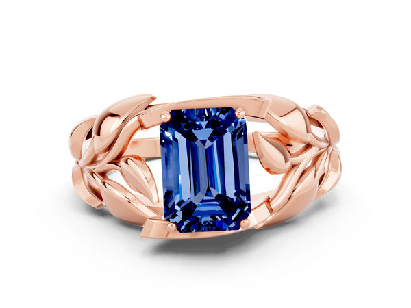 Rose gold Emerald Cut Blue Sapphire Leaf-Inspired Engagement Ring with Round Accents and Prong Setting