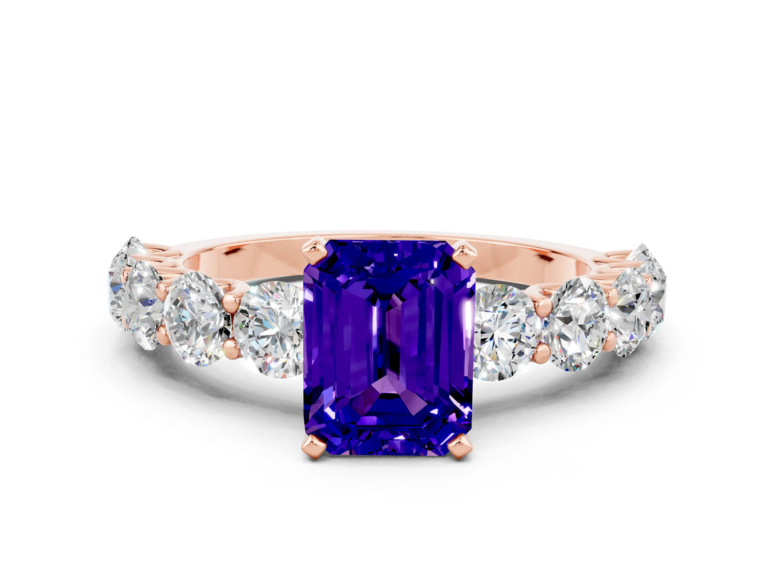 Rose gold Emerald Cut Tanzanite Prong Setting with Side Stones on a Pave Band