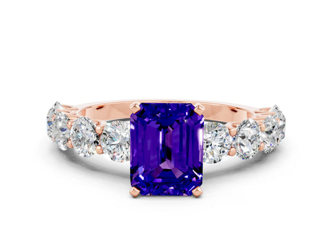 Rose gold Emerald Cut Tanzanite Prong Setting with Side Stones on a Pave Band