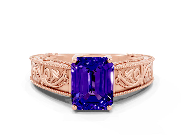 Rose gold Emerald Cut Tanzanite Solitaire Ring with Engraved Band and Four-Prong Setting