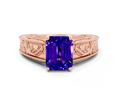 Rose gold Emerald Cut Tanzanite Solitaire Ring with Engraved Band and Four-Prong Setting