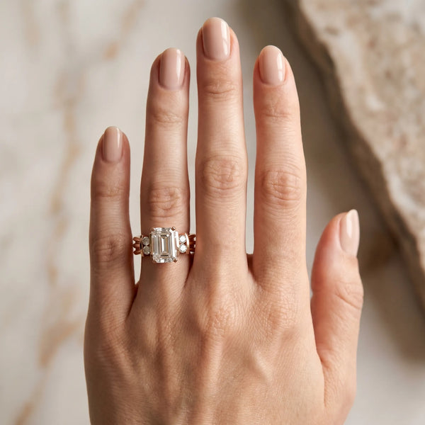 Rose gold Emerald Cut Three-Stone Channel Set Ring with Bar Prongs