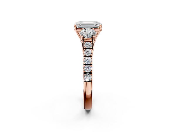 Rose gold Emerald Cut Diamond Three-Stone Ring with Round Side Stones and Pavé Band