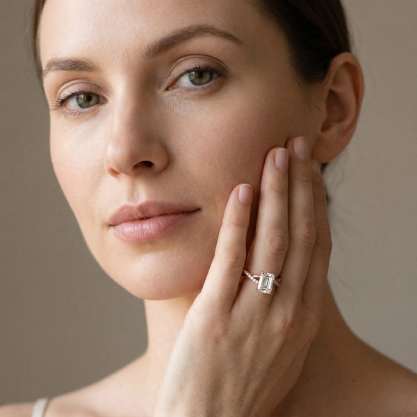 Rose gold Emerald Cut Twist Band Solitaire Diamond Ring with Pavé Setting