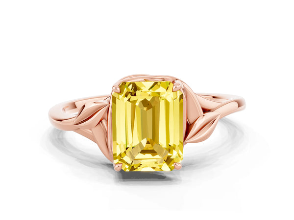 Rose gold Emerald Cut Yellow Sapphire Solitaire Ring with Twist Band and Four-Prong Setting