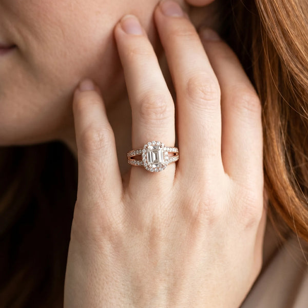 Rose gold Emerald Diamond Halo Ring with Split Shank Pavé Band and Four-Prong Setting