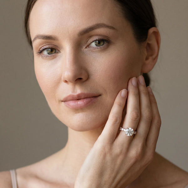 Rose gold Emerald Diamond Solitaire Ring with Shared Prong Round Side Stones