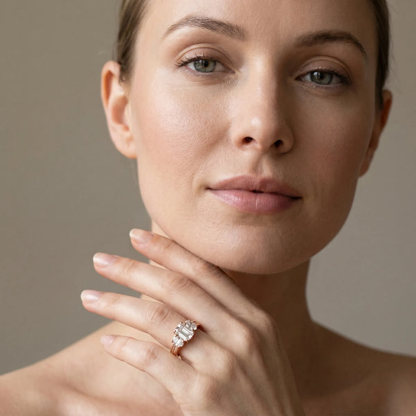 Rose gold Emerald Diamond Three-Stone Ring with Prong Setting and Textured Band