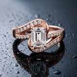 Rose gold Emerald Solitaire Bypass Diamond Engagement Ring with Channel-Set Band and Four-Prong Setting_6
