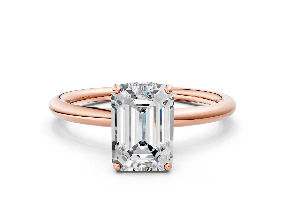 Rose gold Emerald Solitaire Diamond Ring with a Classic Band and Four-Prong Setting