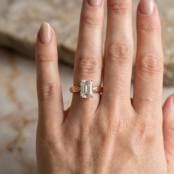 Rose gold Emerald Solitaire Diamond Twisted Band with Four-Prong Setting
