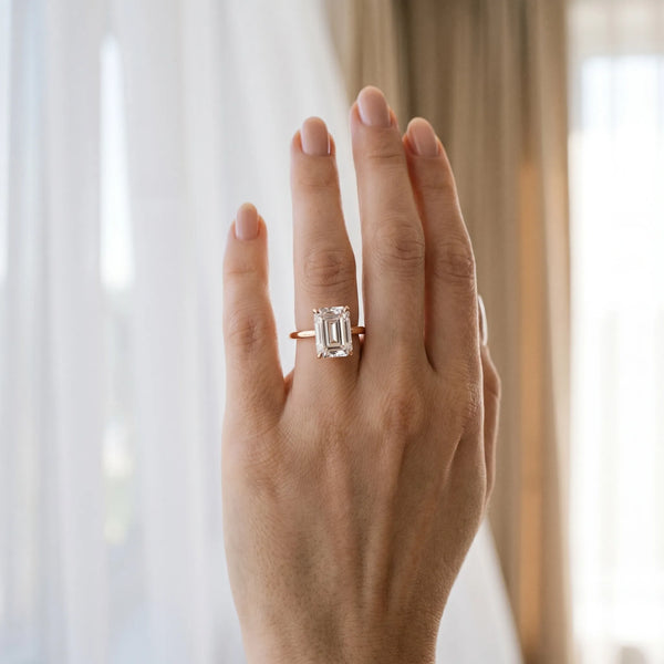 Rose gold Emerald Solitaire Engagement Ring with Cathedral Band and Four-Prong Setting