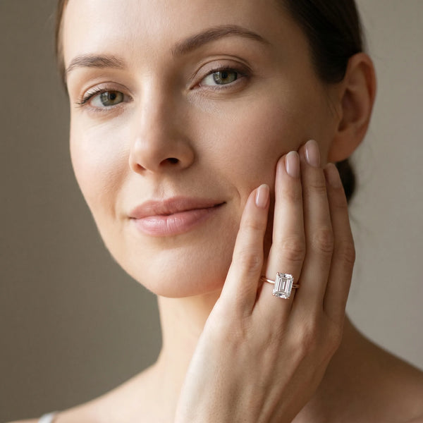 Rose gold Emerald Solitaire Engagement Ring with Cathedral Band and Four-Prong Setting