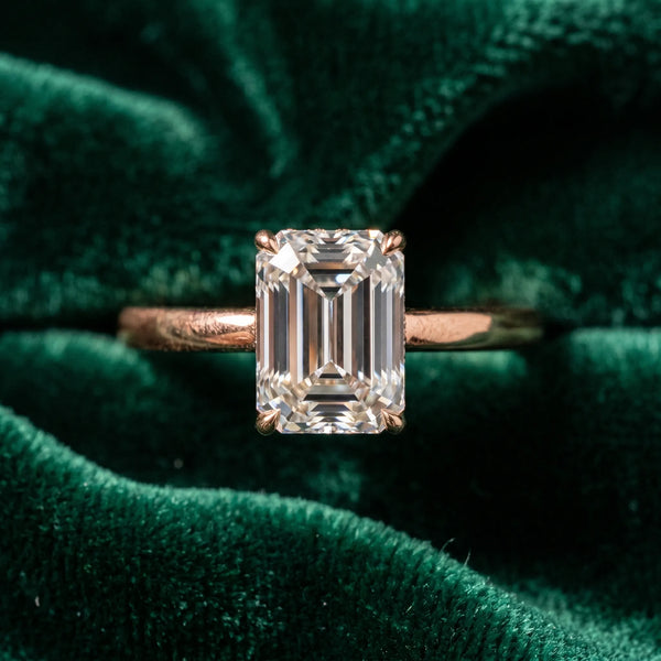 Rose gold Emerald Solitaire Engagement Ring with Cathedral Band and Four-Prong Setting