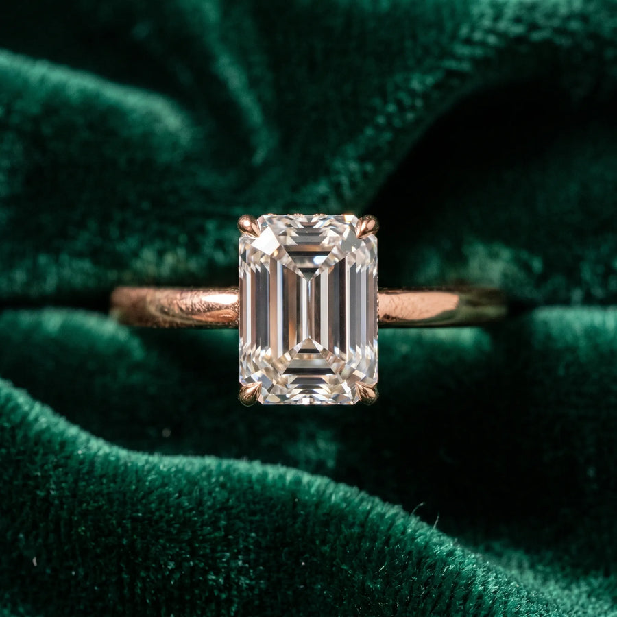 Rose gold Emerald Solitaire Engagement Ring with Cathedral Band and Four-Prong Setting