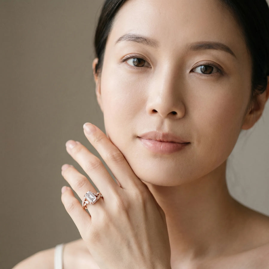 Rose gold Emerald Solitaire with Pavé Twist Band and Four-Prong Setting