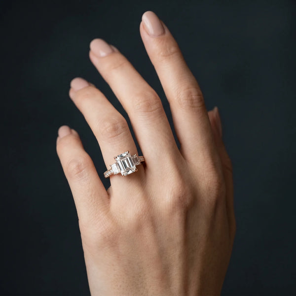 Rose gold Emerald Three-Stone Diamond Ring with Pavé Band and Four-Prong Setting