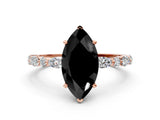 Rose gold Fancy Black Marquise Cut Diamond Solitaire with Side Stones on a Pavé Band and Four-Prong Setting