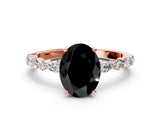 Rose gold Fancy Black Oval Cut Diamond Solitaire with Side Stones on a Pavé Band and Four-Prong Setting