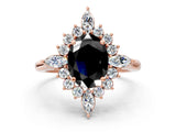 Rose gold Fancy Black Oval Cut Halo Diamond Cluster Ring with Marquise and Round Stones on a White Gold Band with Prong Setting