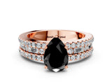 Rose gold Fancy Black Pear Cut Diamond Solitaire Ring with Pavé and Channel Set Band