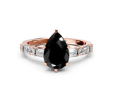 Rose gold Fancy Black Pear Cut Diamond Solitaire with Side Baguettes and Channel Set Band