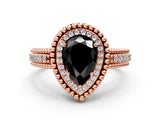 Rose gold Fancy Black Pear Cut Halo Diamond Ring with Beaded Split Shank and Four-Prong Setting