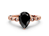 Rose gold Fancy Black Pear Cut Solitaire Diamond Ring with Infinity Twist Band and Four-Prong Setting