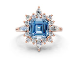 Rose gold Fancy Blue Asscher Cut Halo Diamond Cluster Ring with Marquise and Round Stones on a White Gold Band with Prong Setting