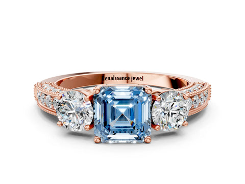Rose gold Fancy Blue Asscher Cut Three-Stone Diamond Ring with Pavé Band and Four-Prong Setting