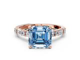 Rose gold Fancy Blue Asscher  Solitaire with Side Baguettes and Channel Set Band
