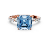 Rose gold Fancy Blue Asscher  Solitaire with Side Stones on a Pavé Band and Four-Prong Setting