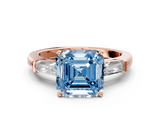 Rose gold Fancy Blue Asscher  Solitaire with Tapered Baguette Side Stones on a Classic Band with Four-Prong Setting