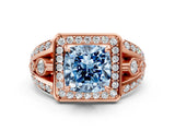 Rose gold Fancy Blue Cushion Cut Diamond Halo Ring with Split Shank and Bezel Accents and Four-Prong Setting