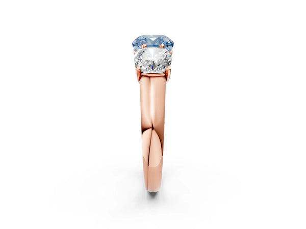 Rose gold Fancy Blue Cushion Cut Three-Stone Diamond Ring with Prong Setting on a Classic Band