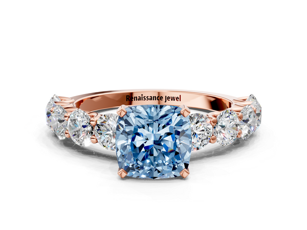 Rose gold Fancy Blue Cushion Cut Diamond Prong Setting with Side Stones on a Pave Band