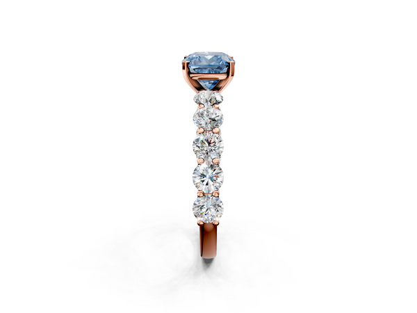 Rose gold Fancy Blue Cushion Cut Diamond Prong Setting with Side Stones on a Pave Band