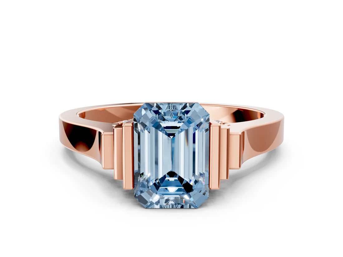 Rose gold Fancy Blue Emerald Cut Brilliant Solitaire Diamond Ring with Channel Set Band and Bar Prong Setting