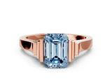 Rose gold Fancy Blue Emerald Cut Brilliant Solitaire Diamond Ring with Channel Set Band and Bar Prong Setting
